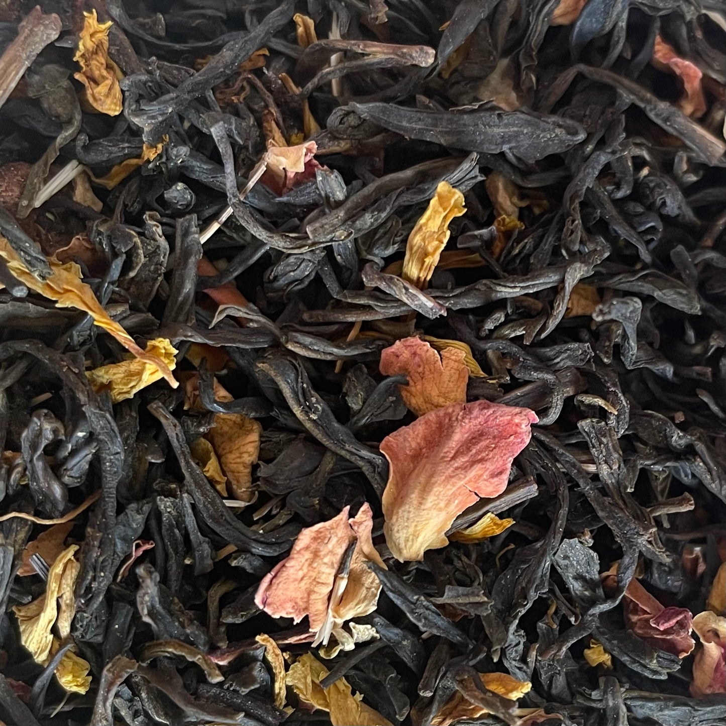 A blend of green tea leaves, with dried fruits, and marigold, and rose petals