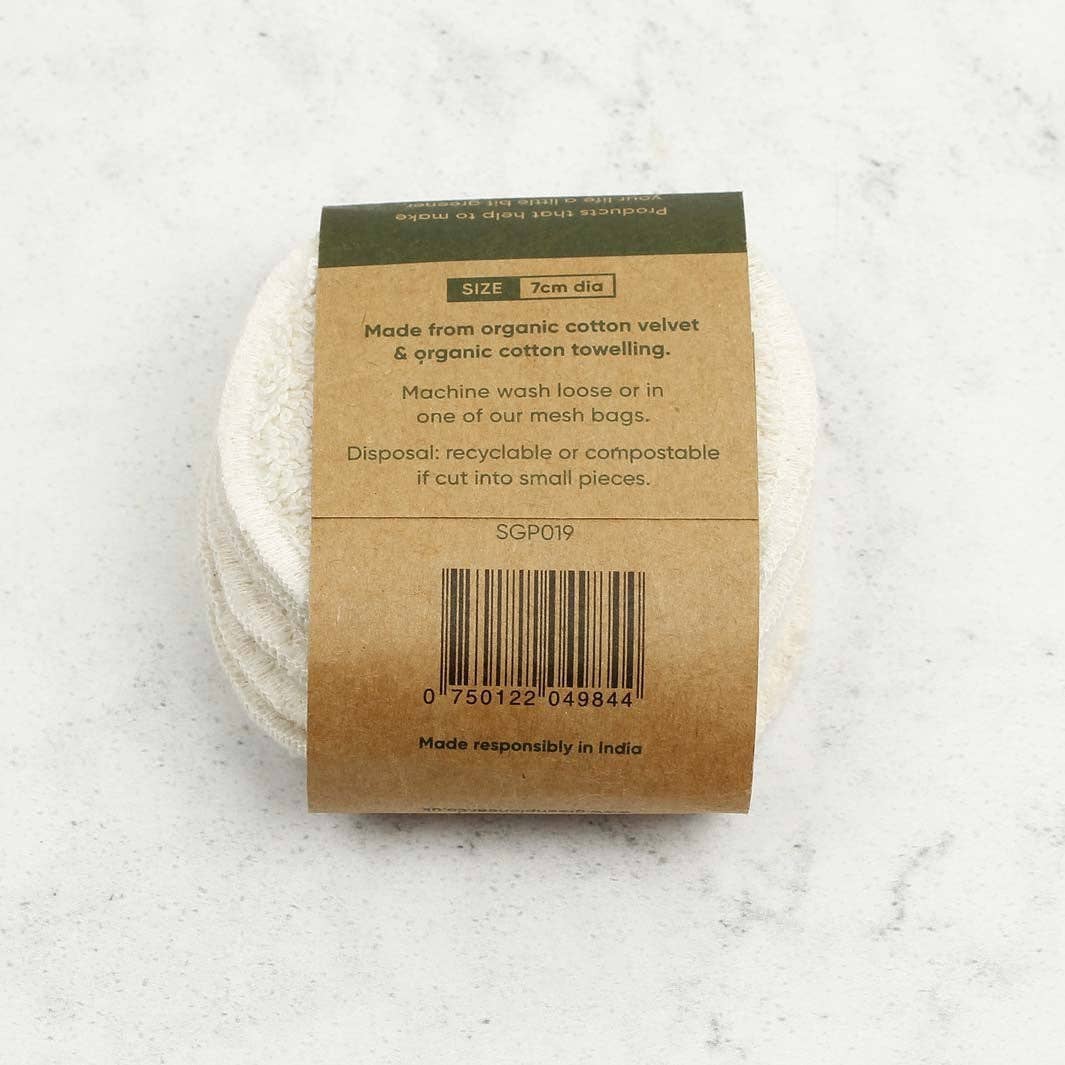 Round cotton reusable facial cotton pads with a brown label shown on a light gray background