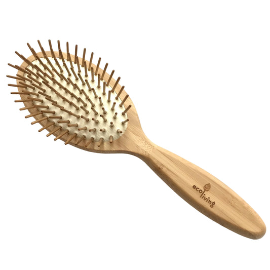 A sustainable bambaoo, oval shaped hairbrush with biodegradable rubber pad and wooden pins.