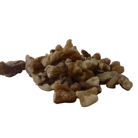 Walnut pieces  scattered on a white background