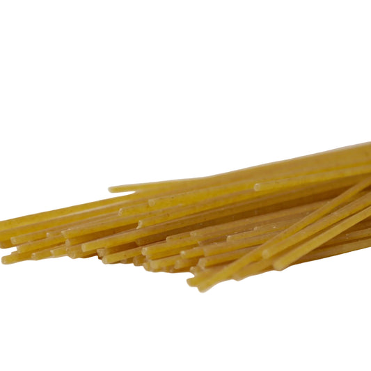 Wholewheat spaghetti shown on a white background