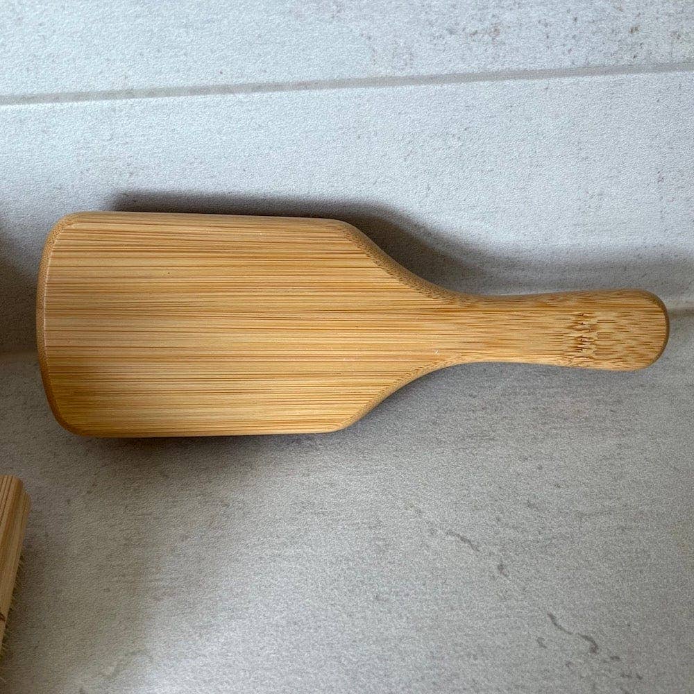 Wooden paddle on a gray surface