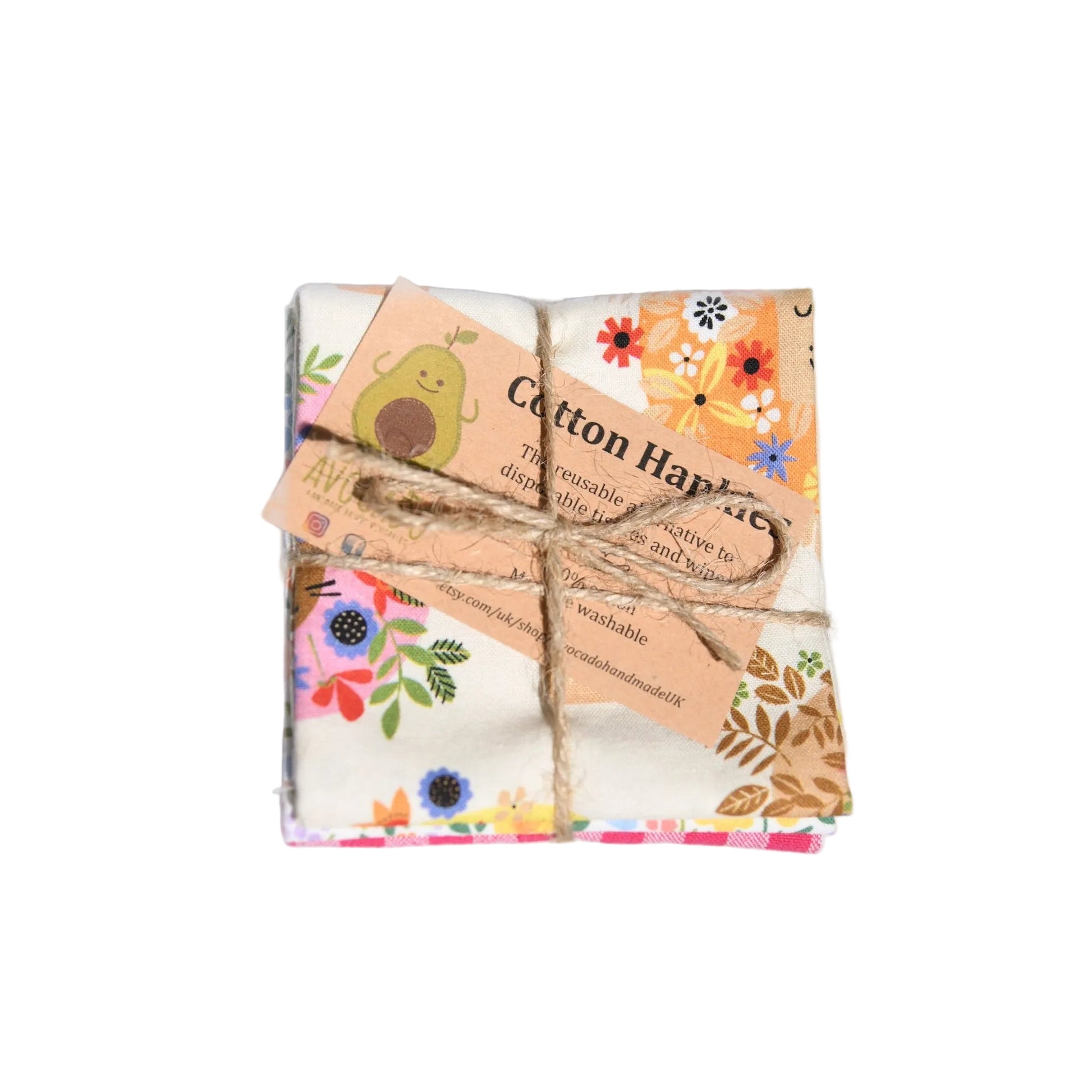 Packaged cotton handkerchiefs with floral patterns on a light gray background