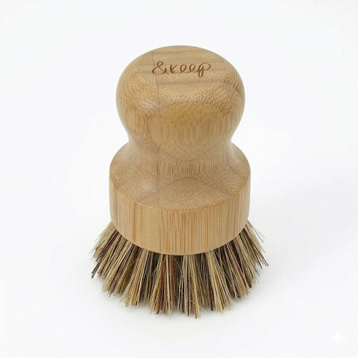 Wooden dish brush with firm bristles on a white background