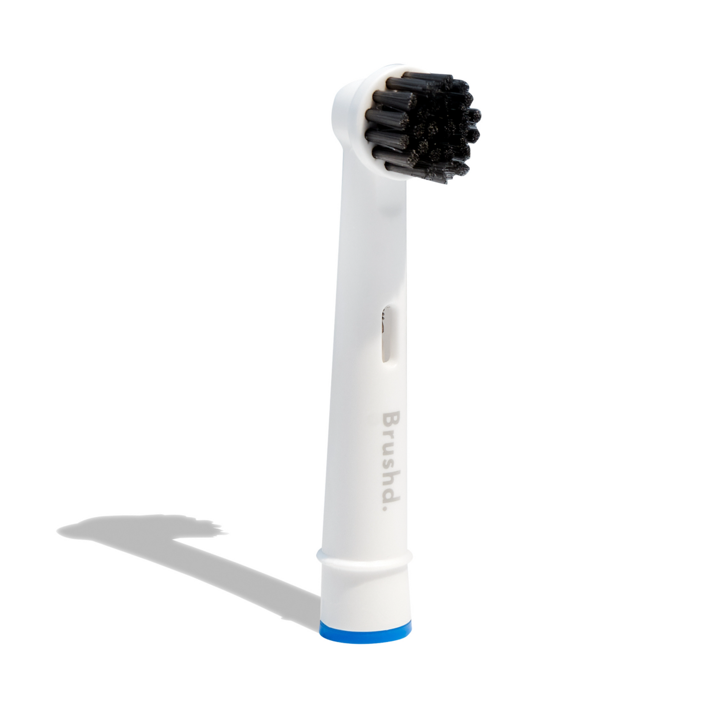 Cardboard box of Brushd 4 replacement heads with activated charcoal for a Oral B electric toothbrush with a freepost sticker for returning the heads for recycling 