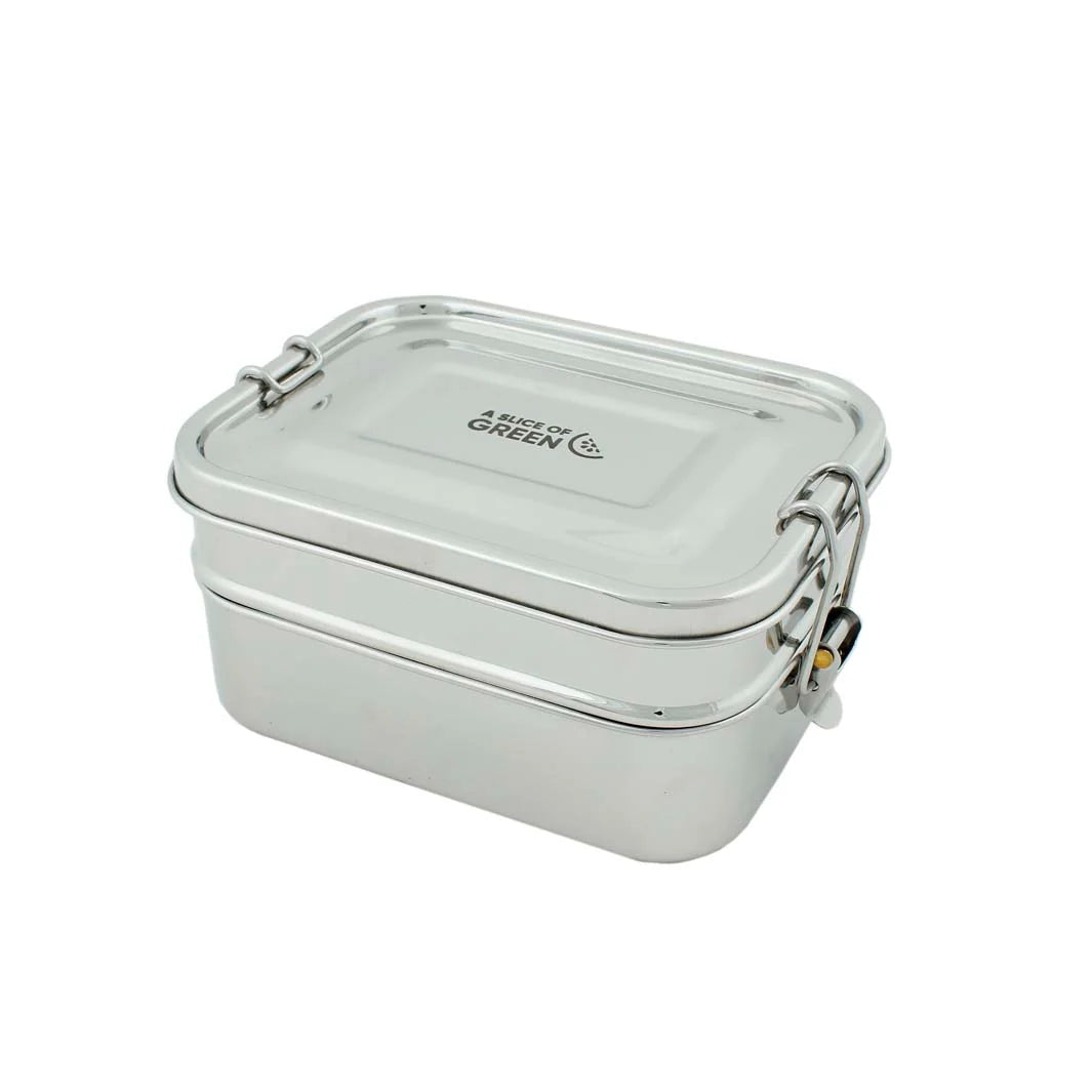 A stainless steel lunch box with a matching lid, featuring a double-walled design and a clamp-lock closure on the sides. The brand name 'A SLICE OF GREEN' is printed on the lid.