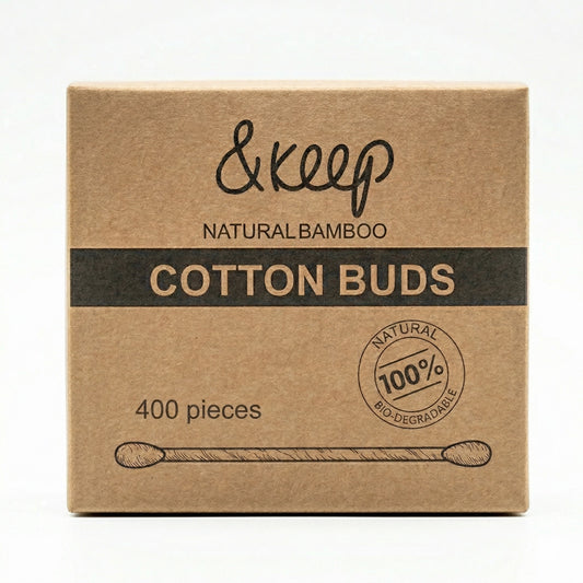 A square kraft paper box of &keep Natural Bamboo Cotton Buds, featuring a black horizontal band with gold lettering and a circular '100% Natural Bio-degradable' seal, on a white background.
