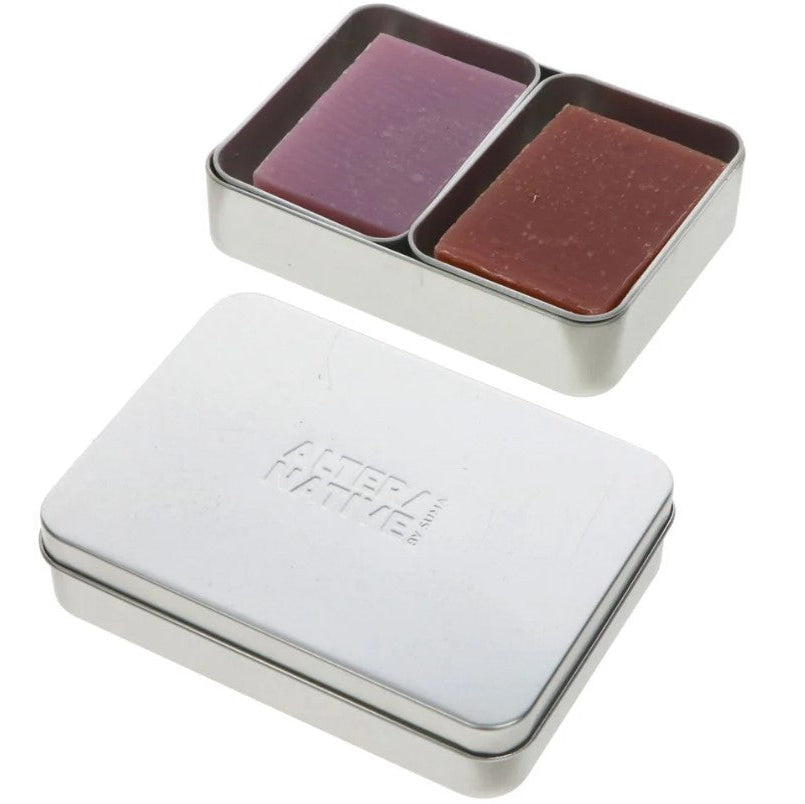 A double aluminium soap tin with 2 inserts with two soap bars and a second tin with Alter/native' branding on the lid