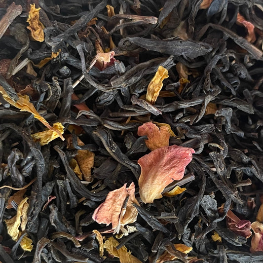 A blend of green tea leaves, with dried fruits, and marigold, and rose petals