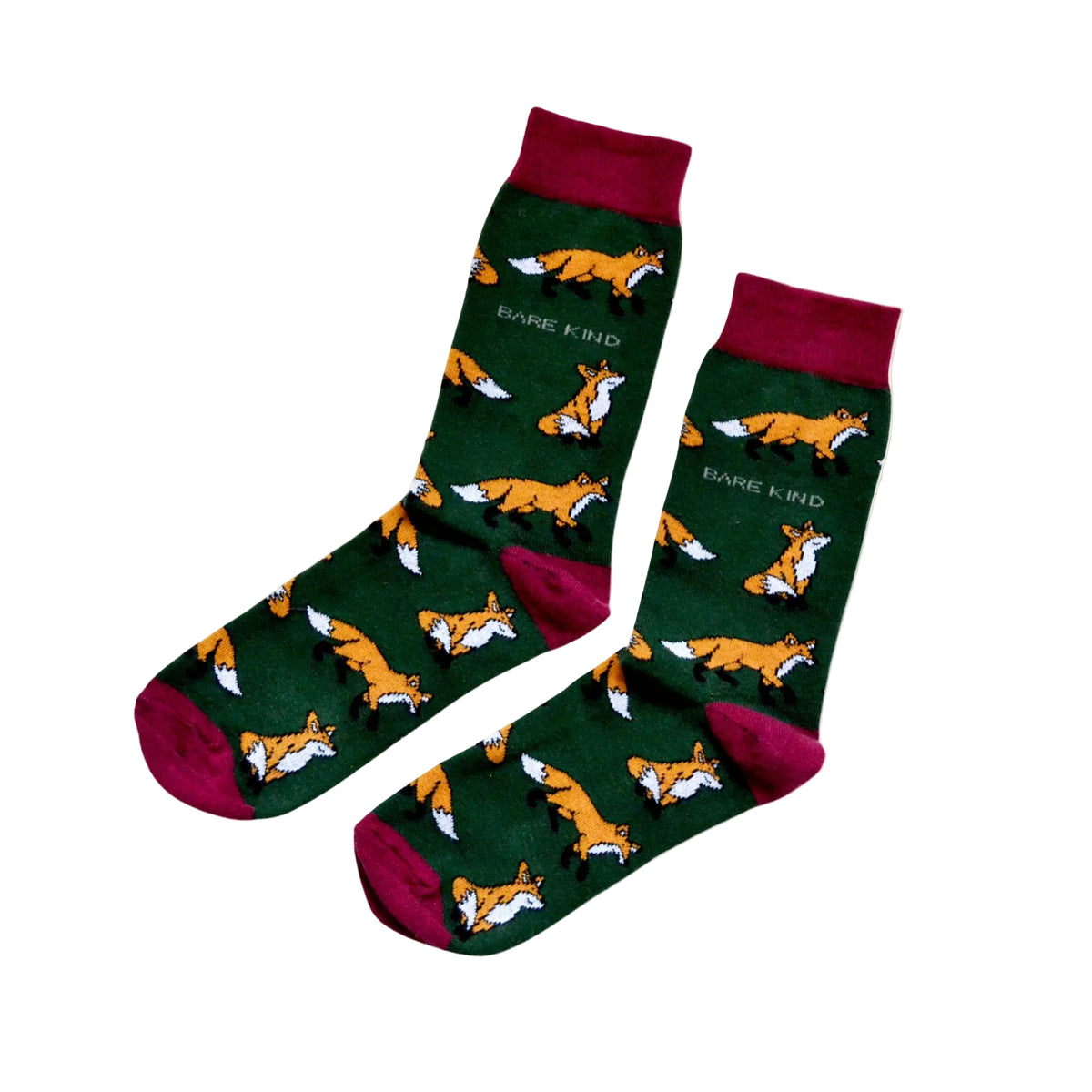 A pair of crew socks with a dark green background featuring a repeating pattern of orange and white foxes. The socks have dark red cuffs, heels, and toes, with the brand name 'BARE KIND' printed in white near the upper calf.