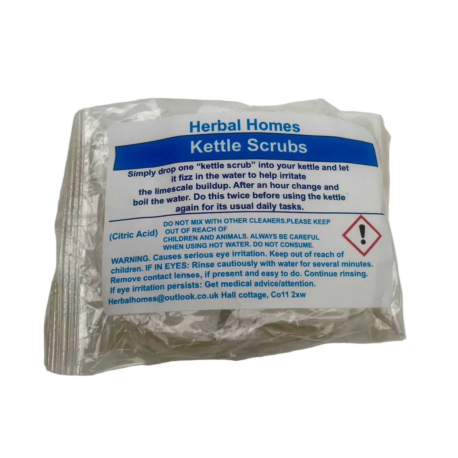 A sealed plastic packet of Herbal Homes Kettle Scrubs with a white and blue printed label, photographed on a plain light background.