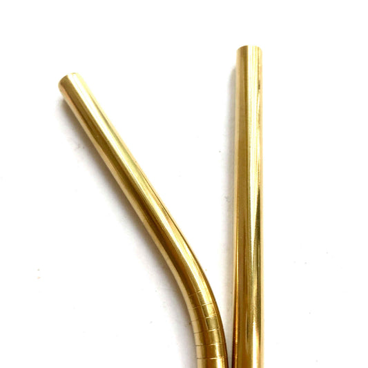 Metal straws gold bent straight close up 