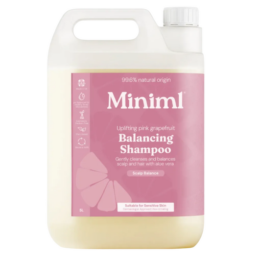 Large bottle of Miniml balancing shampoo with pink label on a white background