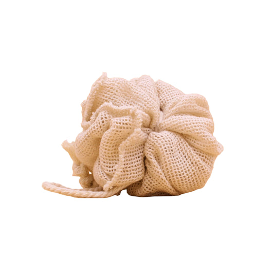 Natural, unbleached mesh bath pouf shown on a white background