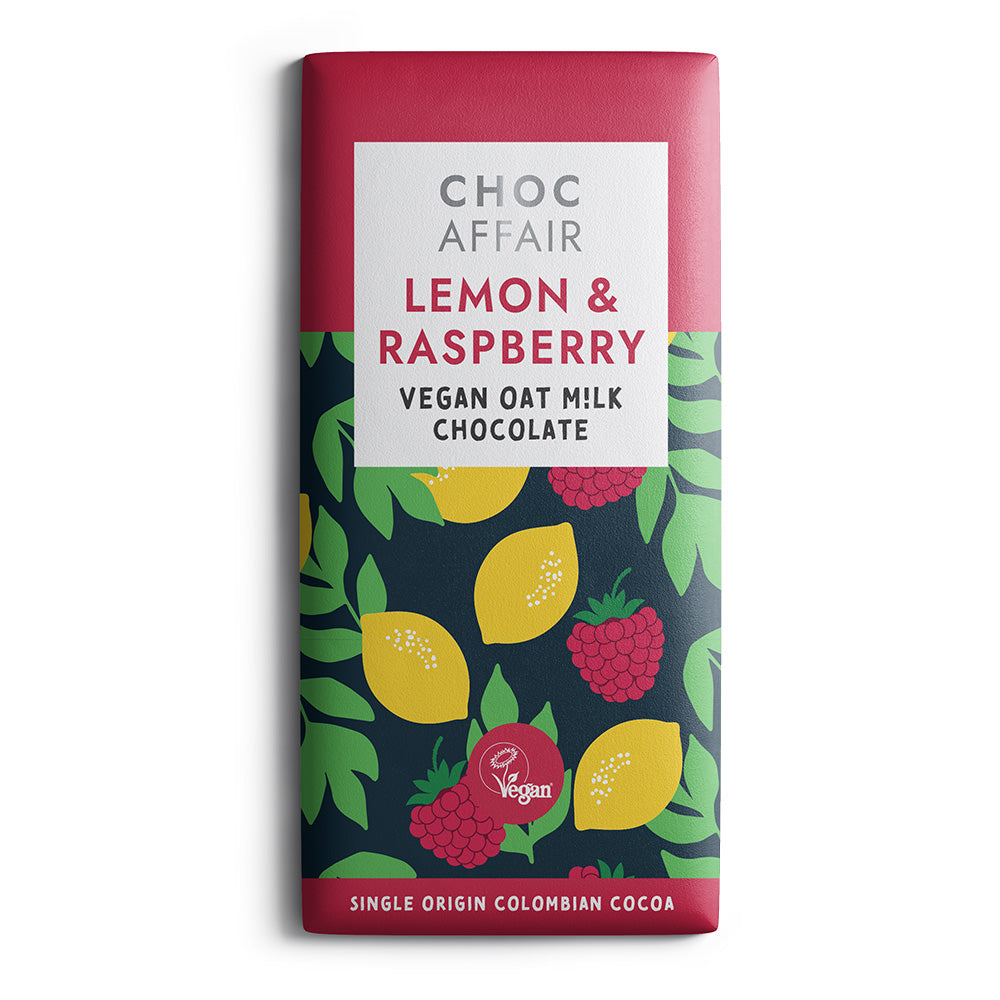 Choc Affair Lemon & Raspberry Vegan Oat Milk Chocolate bar in a rectangular wrapper with a dark navy background, colorful lemon and raspberry illustrations, and a pink top and bottom section.
