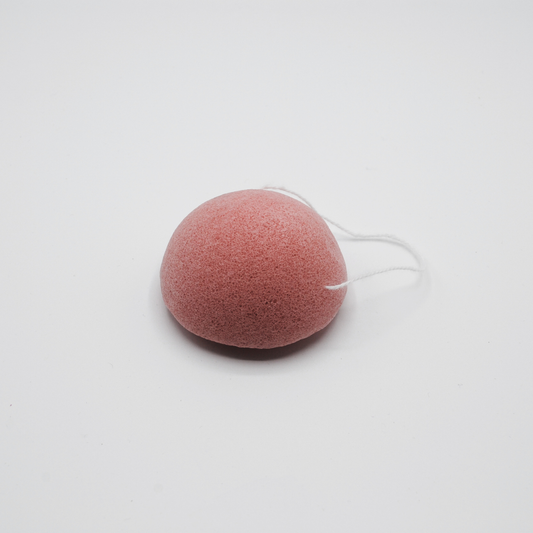 Pink konjac sponge shown on a white background