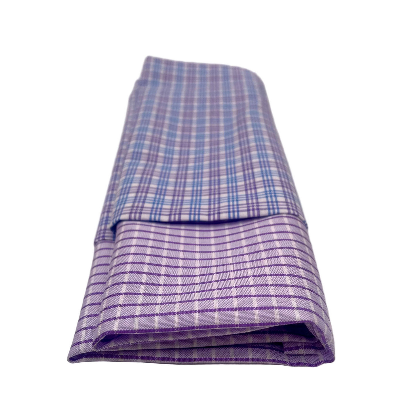 2 folded cotton handkerchiefs in checked, reclaimed shirting cotton, handmade into washable handkerchiefs featuring one with a purple and white checkered pattern and another with with blue and purple line checks, set against a white background.