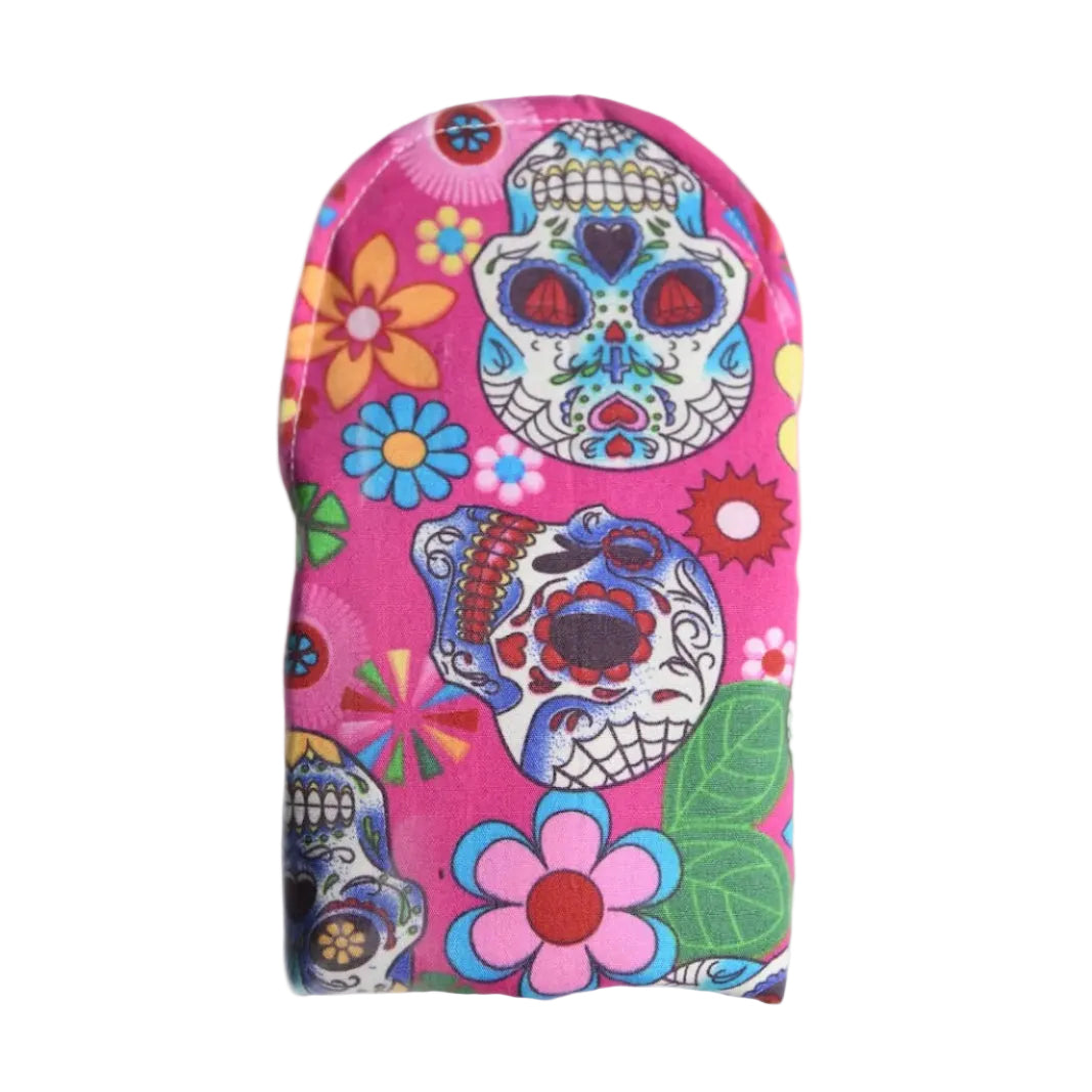 washable period pad on a white background made from pink cotton with colourful skulls patterns
