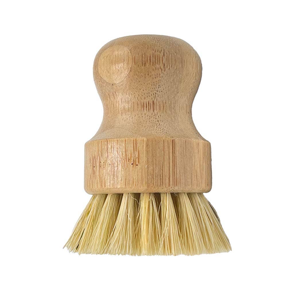 Bamboo dish brush with bristle head on a white background