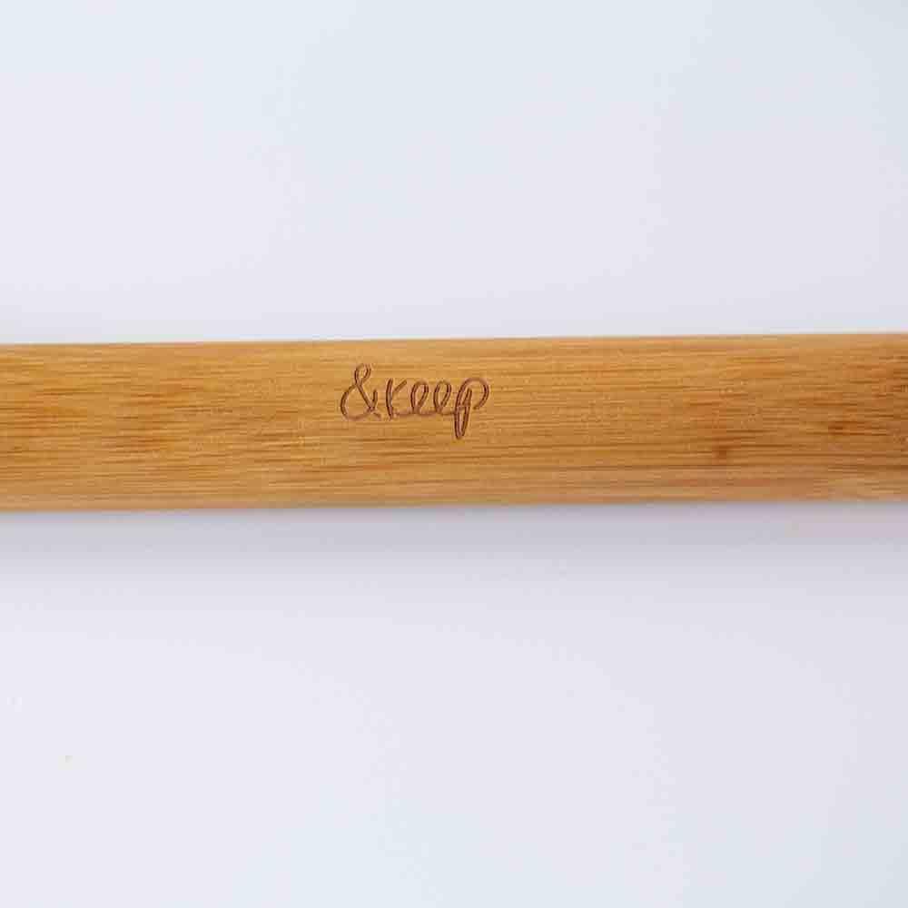 Bamboo toothbrush holder on a white background