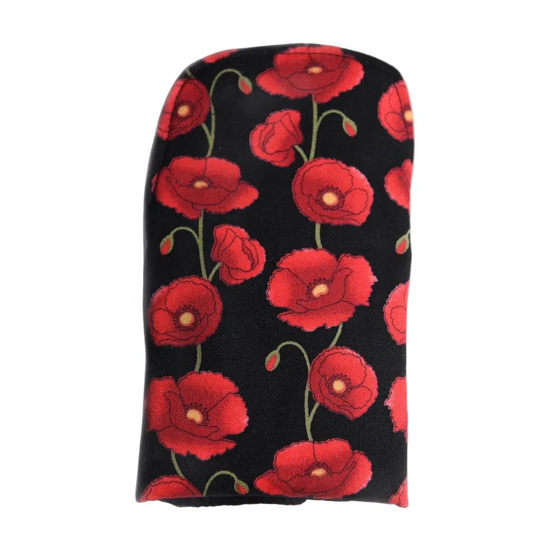 Washable period pad on a white background made from fabric with a black background and a red poppy flower pattern 