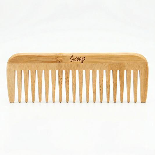 Wooden comb with '&Keep' branding on a white background